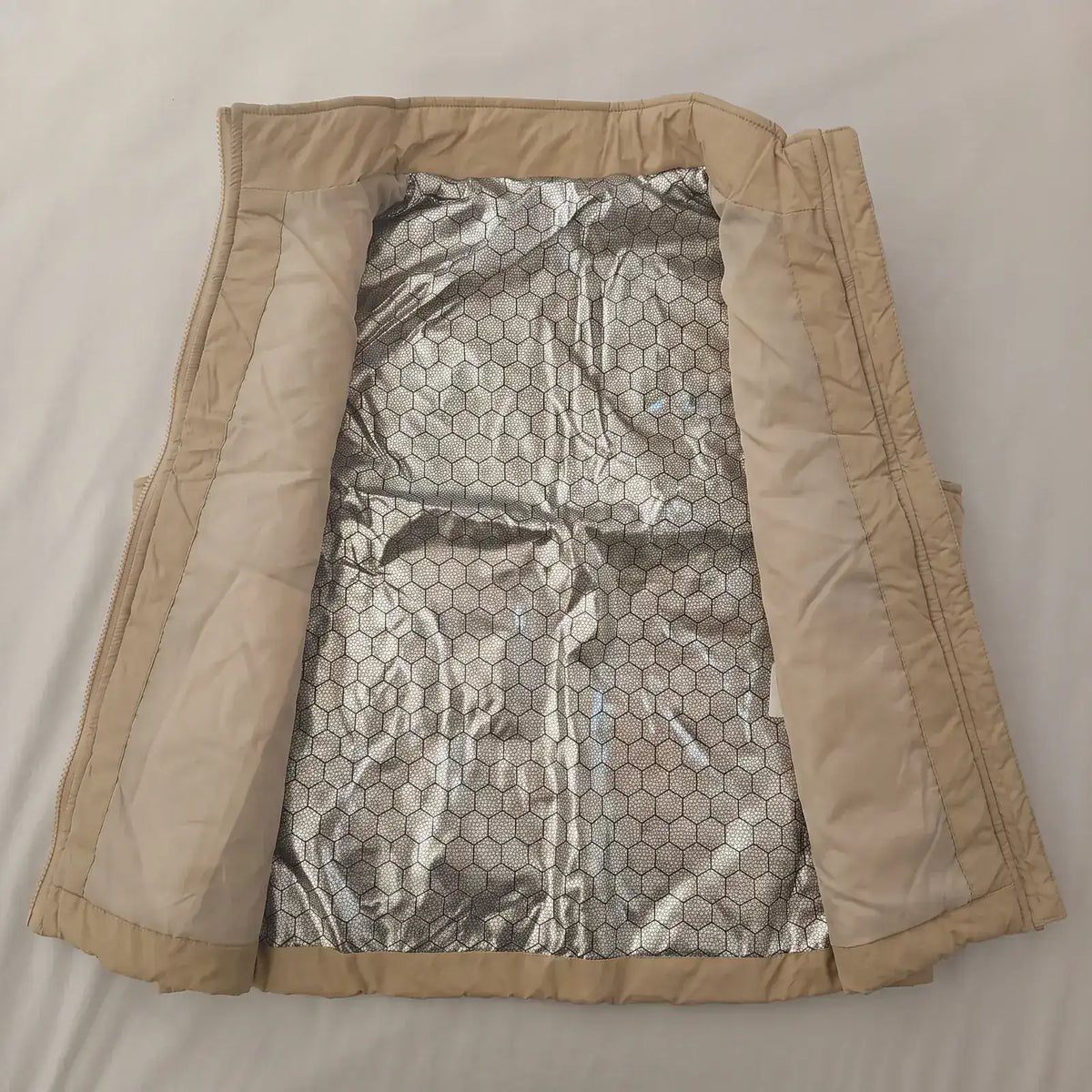 Inside of the women's heated vest with silver honeycomb lining