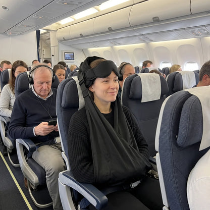 Sliding the arms into the arm sling in an economy seat